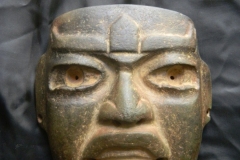 Olmec: Grayish-Black Stone mask, with traces of red cinnabar, style possible from the region of Southern Veracruz, Coast of Mexico, circa 600 to 350 B.C. Dimensions 13cm x 14cm